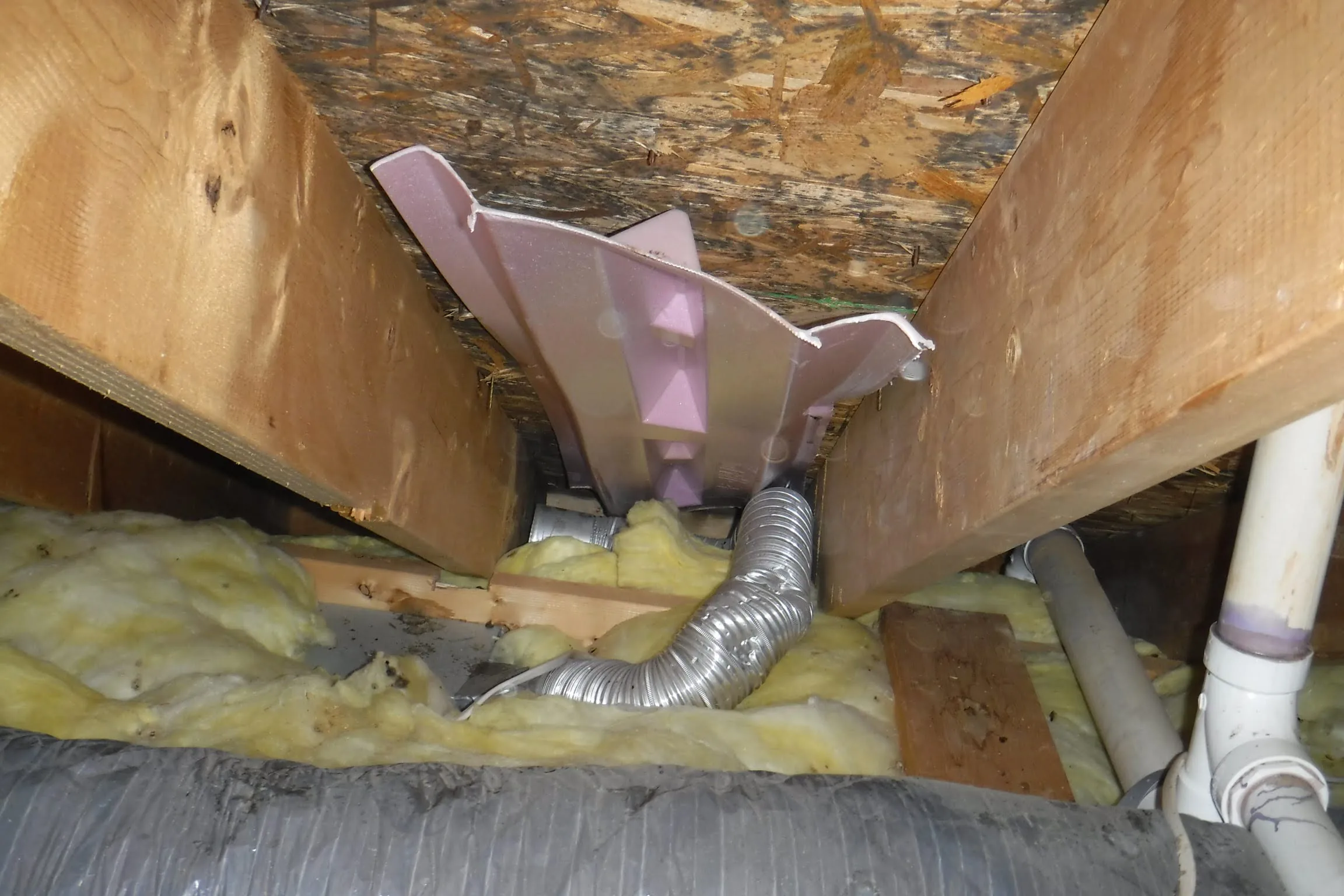 Crumpled and crushed bathroom exhaust duct restricting the airflow path