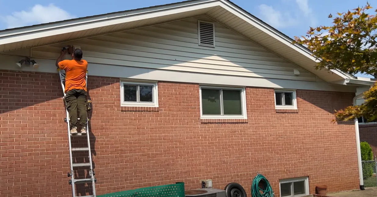 Two bathroom exhaust termination caps installed through the exterior gable wall