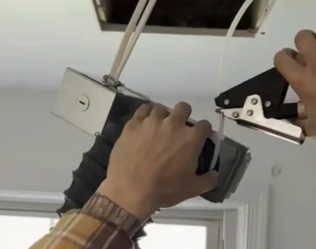 Zip tie securing a bathroom exhaust duct connection mechanically