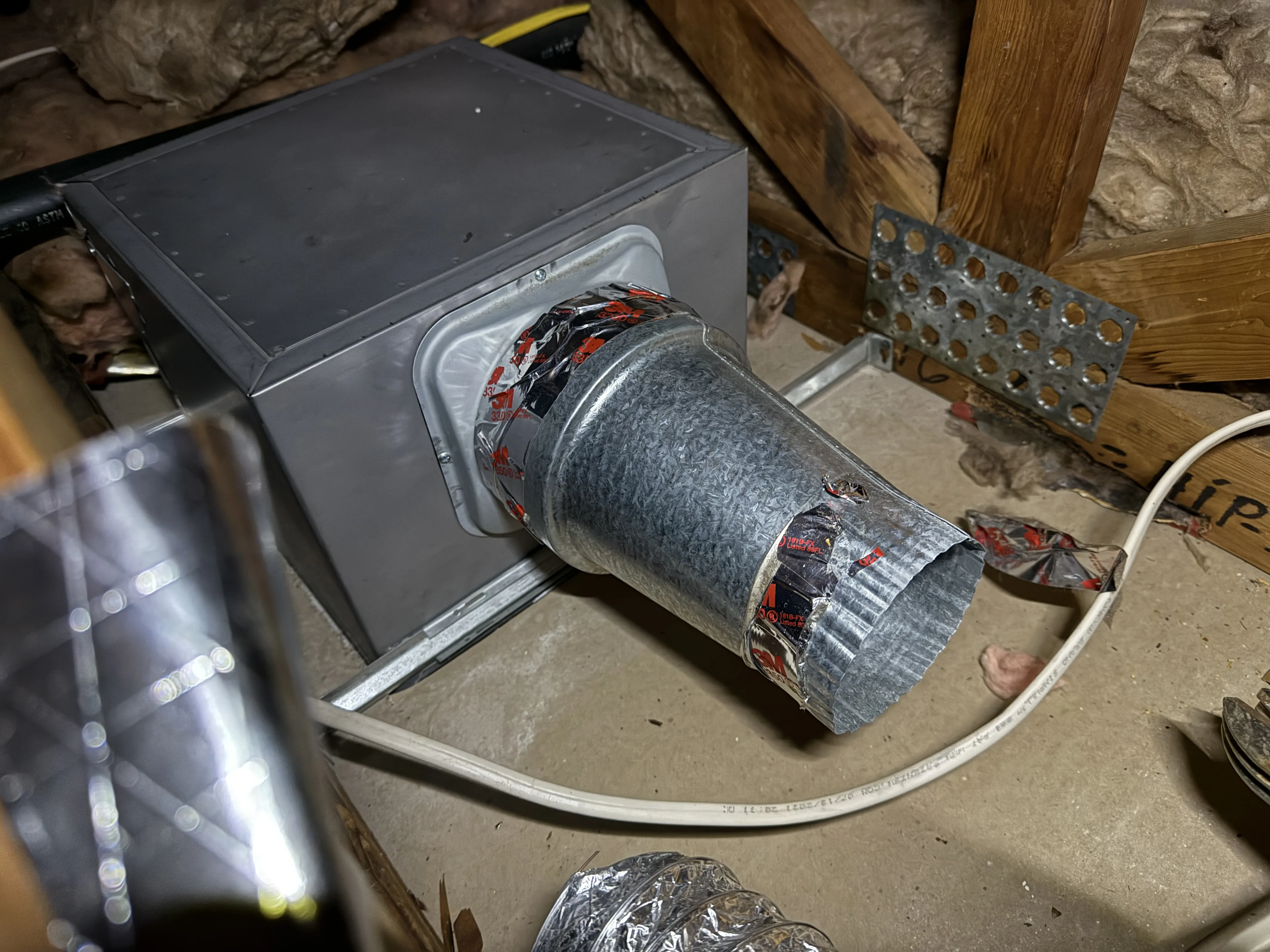 Four-inch bathroom exhaust fan outlet reduced down to three-inch duct