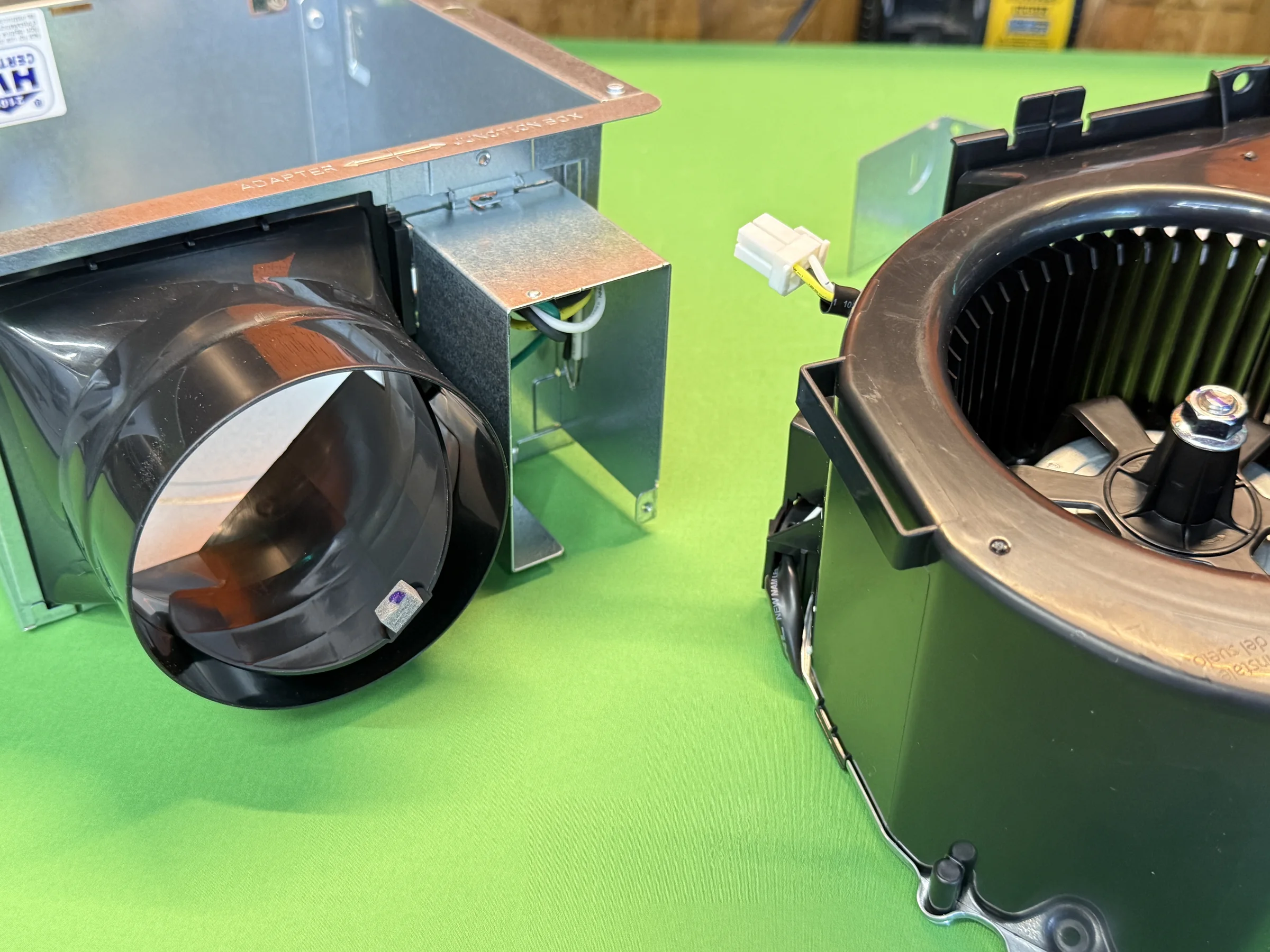 Panasonic Whisper Mighty duct adapter beside the motor assembly