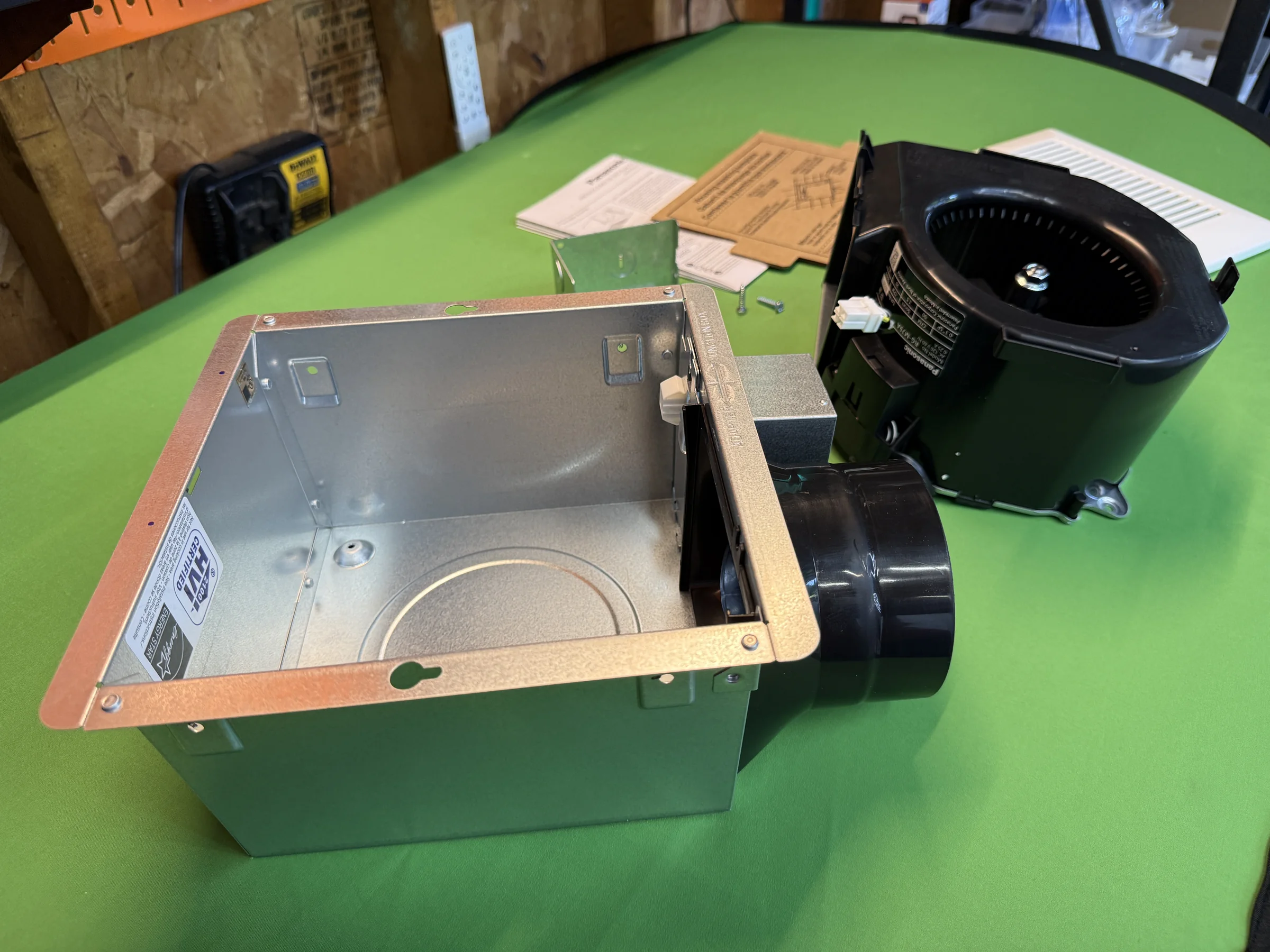 Panasonic Whisper Mighty motor assembly beside the compact metal fan housing